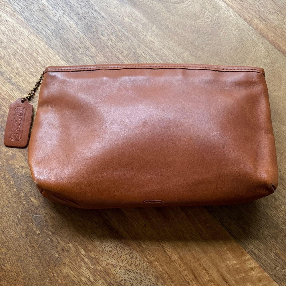 Coach leather clutch.  Zipper enclosure. Preloved, minor signs of wear.